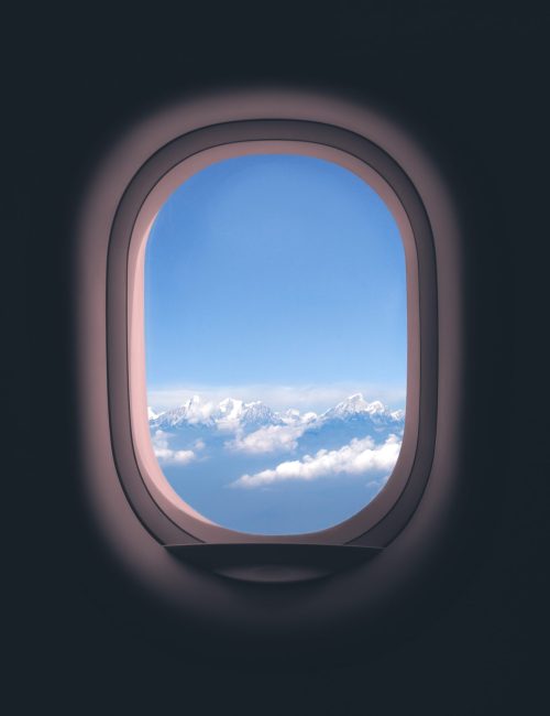 Airplane window. Mountain and clouds view